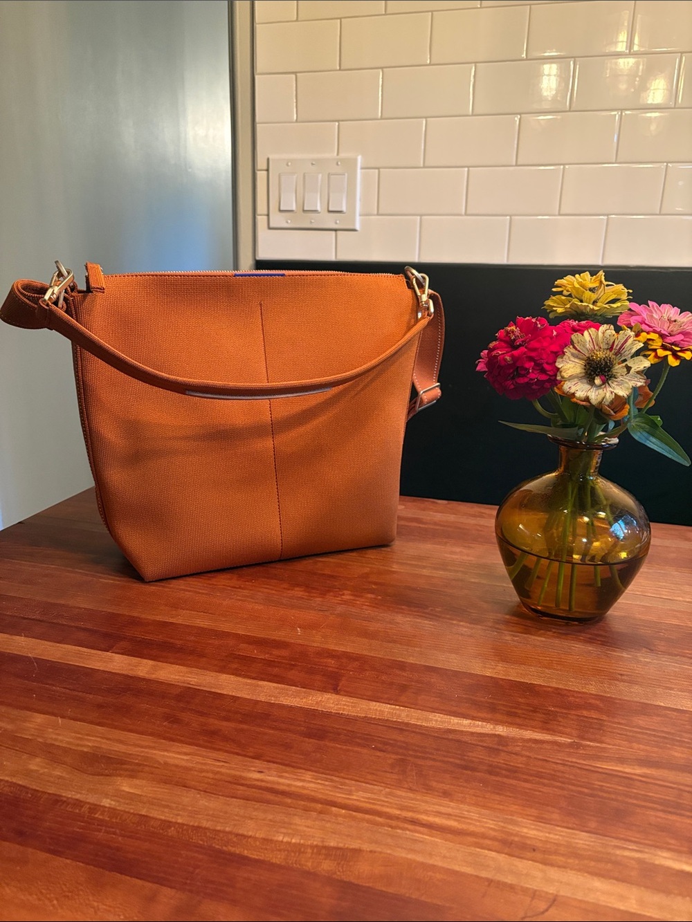 Rothy’s Mini Zip Bucket Bag, in burnt orange, like new